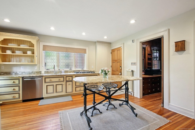 836 Prospect Ave, Hartford, CT 06105 - kitchen featuring stainless steel dishwasher, a sink, light wood-type flooring, recessed lighting, and cream cabinets