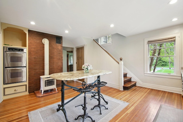 836 Prospect Ave, Hartford, CT 06105 - office with a wood stove, baseboards, light wood finished floors, and recessed lighting