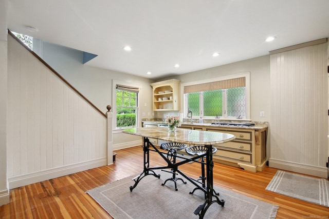 836 Prospect Ave, Hartford, CT 06105 - dining room with light wood-style floors, stairs, baseboards, recessed lighting, and wooden walls