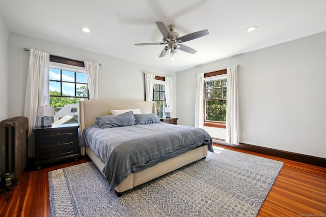 836 Prospect Ave, Hartford, CT 06105 - bedroom with radiator, multiple windows, dark wood finished floors, recessed lighting, and a ceiling fan
