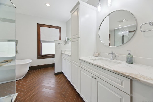 836 Prospect Ave, Hartford, CT 06105 - bathroom with a freestanding bath, vanity, baseboards, and recessed lighting
