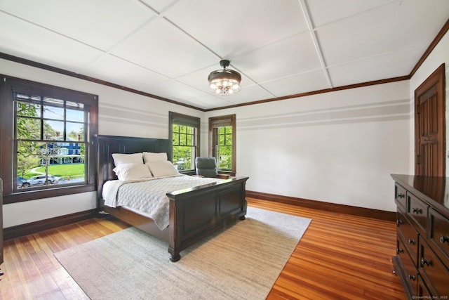 836 Prospect Ave, Hartford, CT 06105 - bedroom featuring multiple windows, wood finished floors, baseboards, and ornamental molding