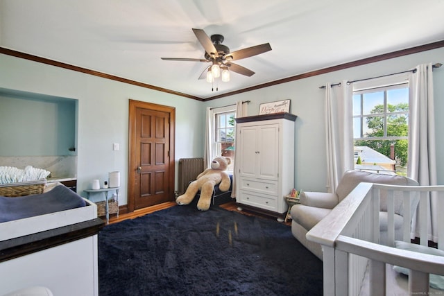 836 Prospect Ave, Hartford, CT 06105 - bedroom with ornamental molding, dark wood finished floors, ceiling fan, and baseboards