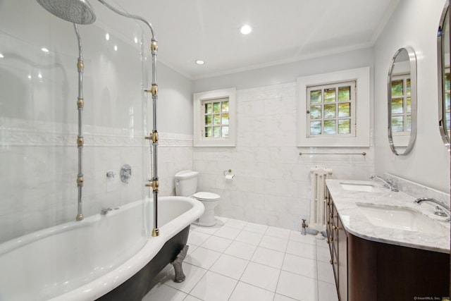 836 Prospect Ave, Hartford, CT 06105 - bathroom featuring radiator heating unit, tile walls, toilet, ornamental molding, and a tub to relax in