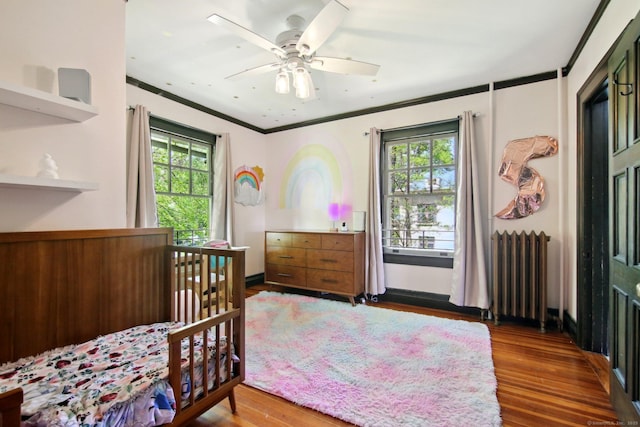 836 Prospect Ave, Hartford, CT 06105 - bedroom featuring radiator, wood finished floors, crown molding, and ceiling fan