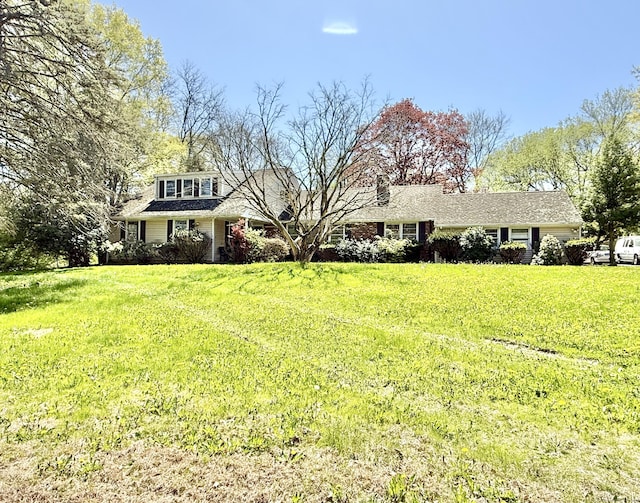 view of front of house with a front lawn