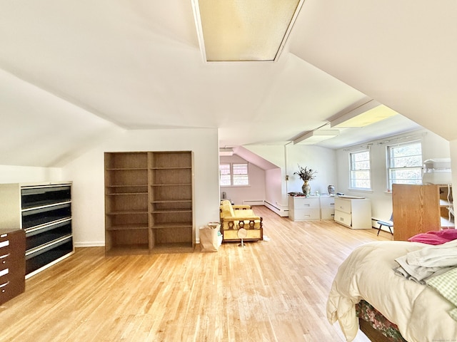 bedroom with light wood-style floors, a baseboard radiator, lofted ceiling, and multiple windows