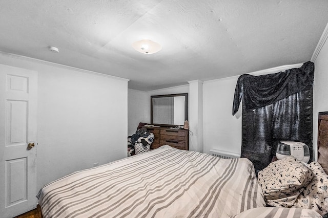 bedroom featuring crown molding