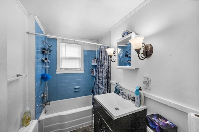 bathroom featuring crown molding, shower / bath combination with curtain, and vanity