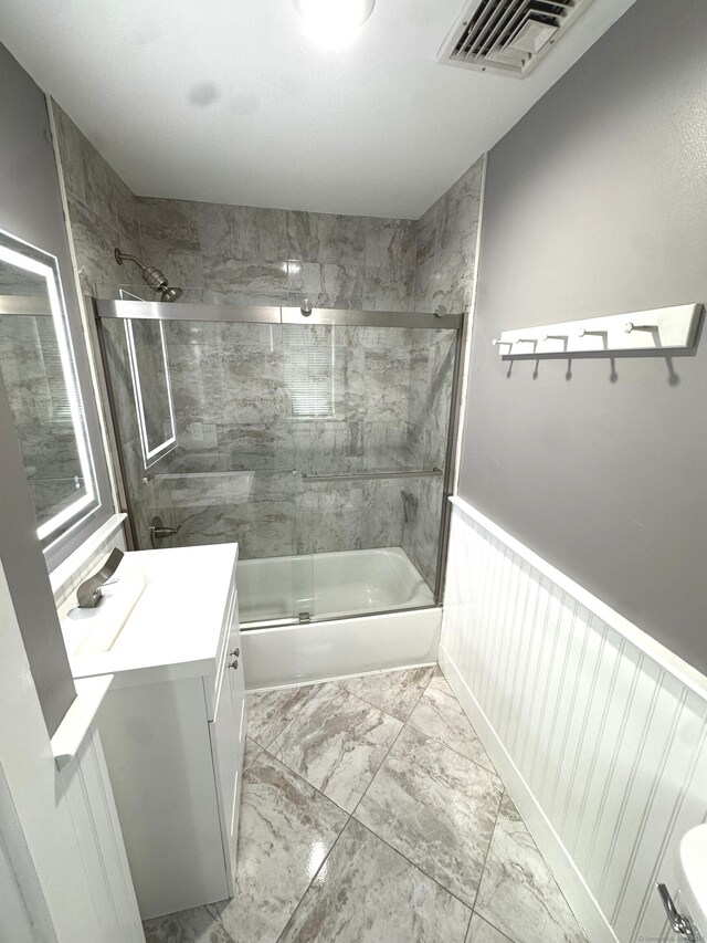 6 Fulton Dr, New Fairfield, CT 06812 - bathroom featuring vanity, marble finish floor, combined bath / shower with glass door, and visible vents