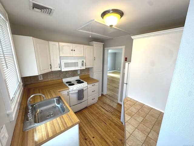 6 Fulton Dr, New Fairfield, CT 06812 - kitchen with wooden counters, visible vents, a sink, white appliances, and white cabinetry