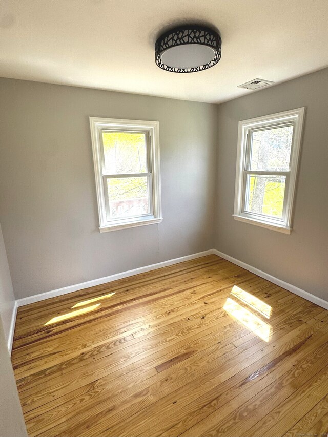 6 Fulton Dr, New Fairfield, CT 06812 - unfurnished room featuring visible vents, baseboards, and wood finished floors