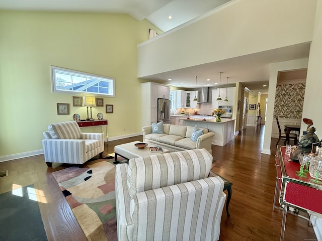 living area featuring high vaulted ceiling, recessed lighting, baseboards, dark wood-type flooring, and visible vents