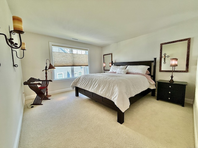 carpeted bedroom featuring baseboards