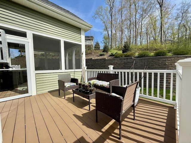 wooden deck with an outdoor living space