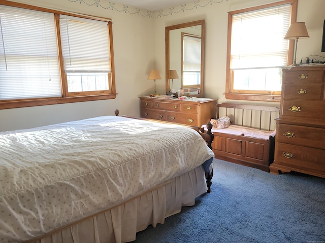 bedroom featuring light colored carpet
