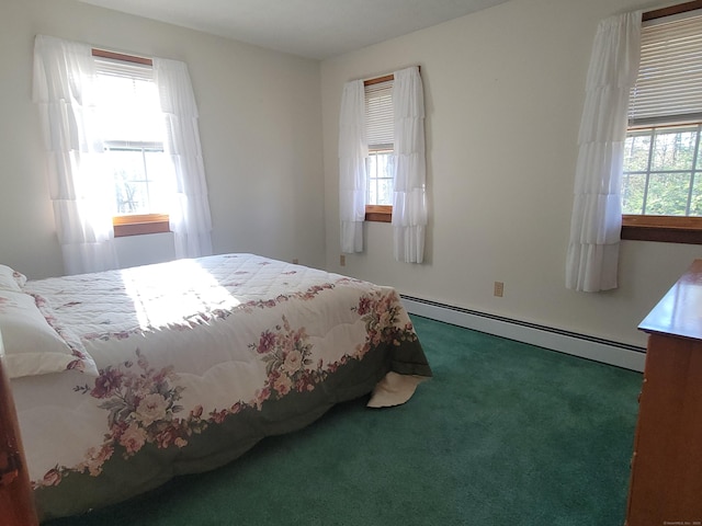 carpeted bedroom featuring a baseboard radiator