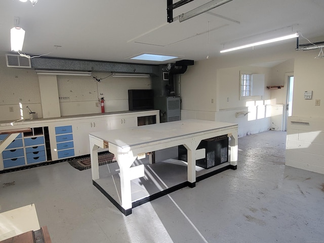 garage with visible vents and a workshop area