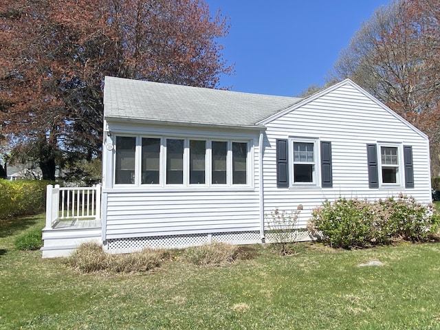 318 Billow Rd, Old Lyme, CT 06371 - view of home's exterior featuring roof with shingles and a yard
