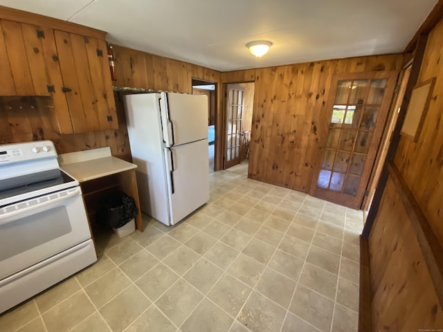 318 Billow Rd, Old Lyme, CT 06371 - kitchen with wooden walls, light countertops, brown cabinetry, and white appliances