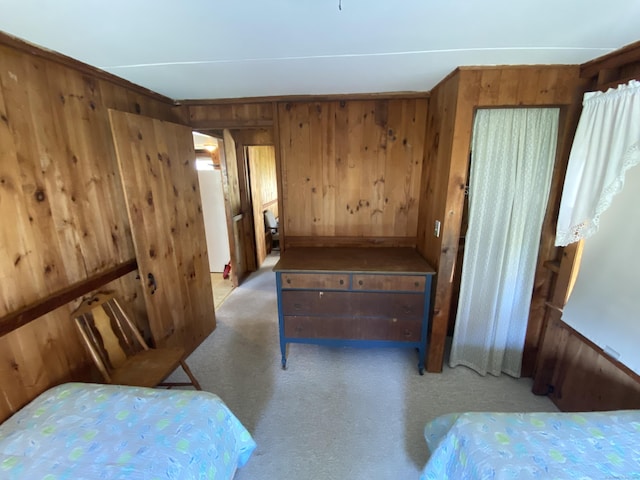 318 Billow Rd, Old Lyme, CT 06371 - bedroom with wooden walls and light colored carpet