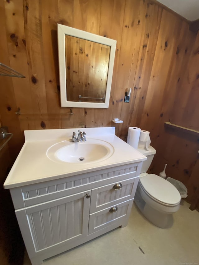318 Billow Rd, Old Lyme, CT 06371 - half bath with wooden walls, vanity, and toilet