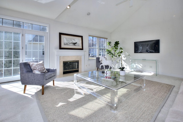 living room with high vaulted ceiling, baseboards, a fireplace, and carpet flooring