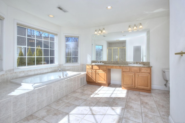 full bathroom featuring a garden tub, visible vents, tile patterned flooring, a shower stall, and vanity