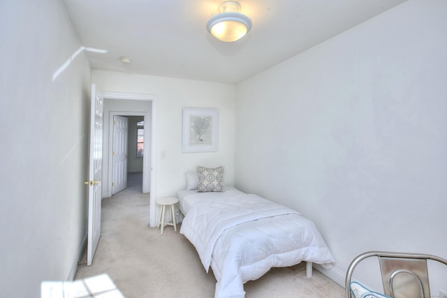 bedroom with light colored carpet
