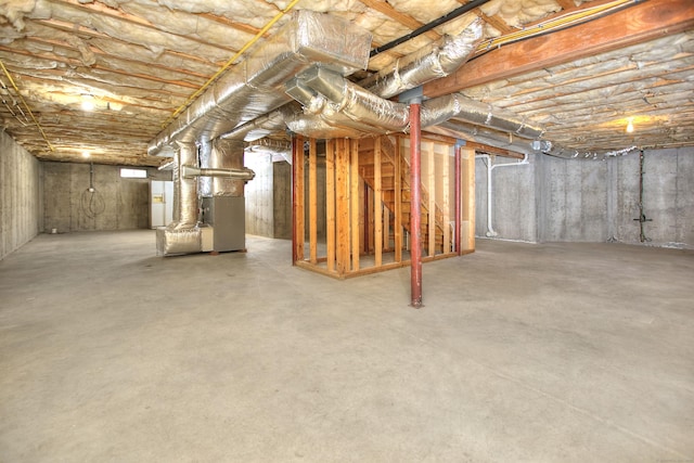 unfinished below grade area featuring heating unit