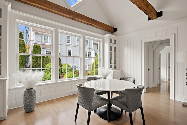 sunroom / solarium featuring visible vents, a wealth of natural light, and beam ceiling