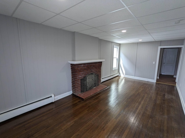327 Center St, West Haven, CT 06516 - unfurnished living room with baseboards, a baseboard radiator, dark wood-style flooring, and a paneled ceiling