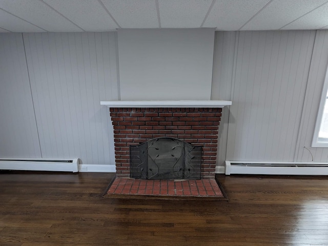 327 Center St, West Haven, CT 06516 - room details featuring a fireplace, wood finished floors, and a baseboard radiator