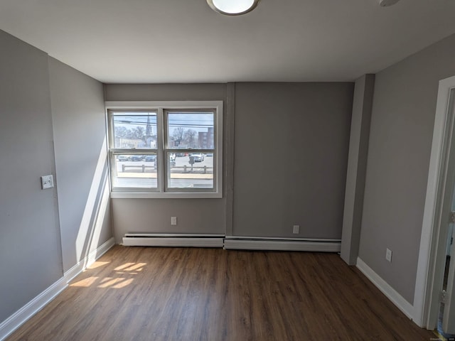 327 Center St, West Haven, CT 06516 - unfurnished room with baseboards, a baseboard heating unit, and wood finished floors