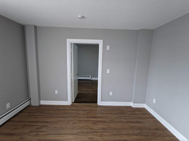 327 Center St, West Haven, CT 06516 - spare room featuring dark wood-type flooring, baseboards, and a baseboard heating unit