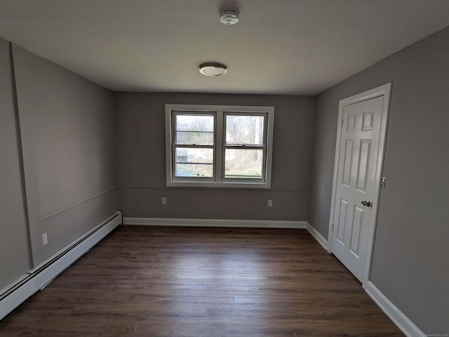 327 Center St, West Haven, CT 06516 - empty room with baseboards, baseboard heating, and dark wood-style floors