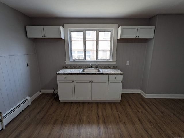 327 Center St, West Haven, CT 06516 - kitchen with white cabinets, baseboard heating, dark wood-style floors, and a sink