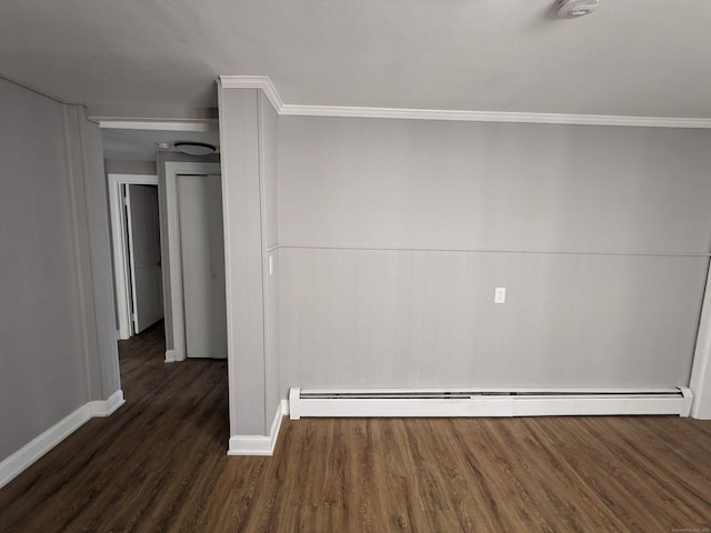 327 Center St, West Haven, CT 06516 - empty room featuring baseboards, a baseboard heating unit, wainscoting, and wood finished floors