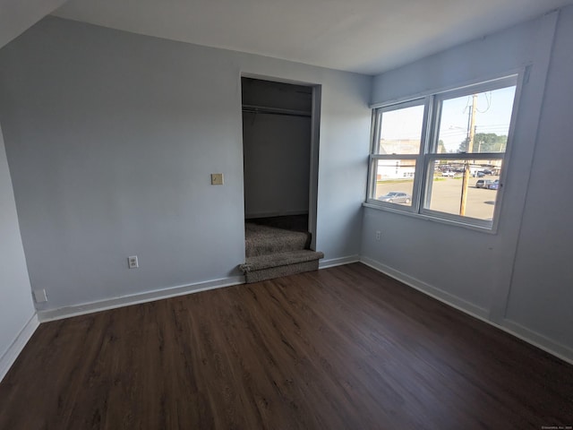 327 Center St, West Haven, CT 06516 - unfurnished bedroom with baseboards, a closet, and dark wood-style flooring