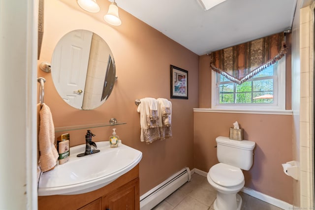 bathroom featuring tile patterned flooring, baseboard heating, baseboards, vanity, and toilet