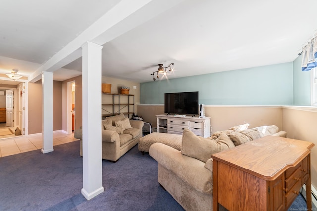 carpeted living area featuring baseboards, baseboard heating, and tile patterned floors