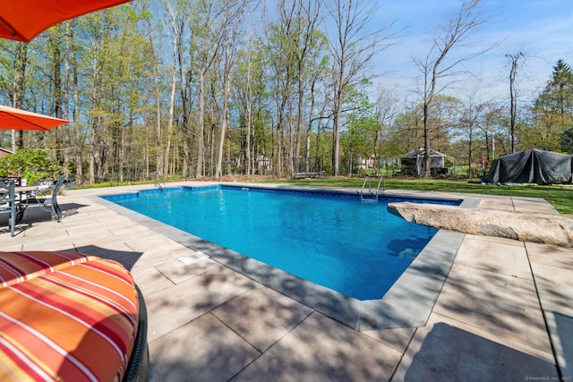 pool featuring a patio