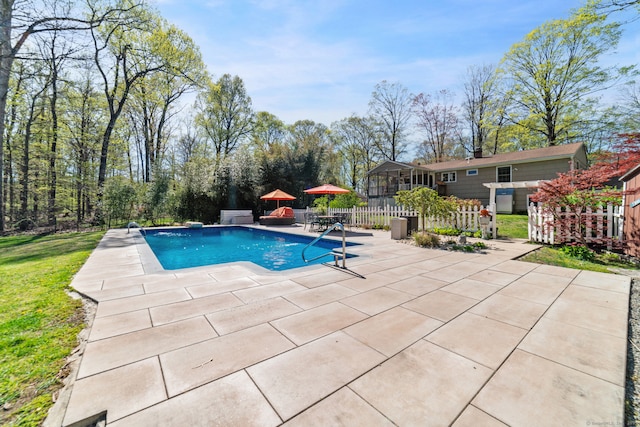 view of swimming pool with a patio, fence, and a fenced in pool