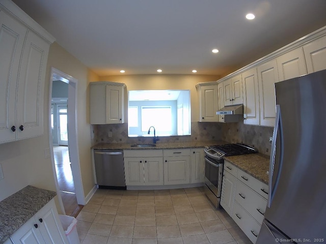 5 Mansfield Grove Rd Apt 342, East Haven, CT 06512 - kitchen with a sink, tasteful backsplash, under cabinet range hood, white cabinetry, and appliances with stainless steel finishes