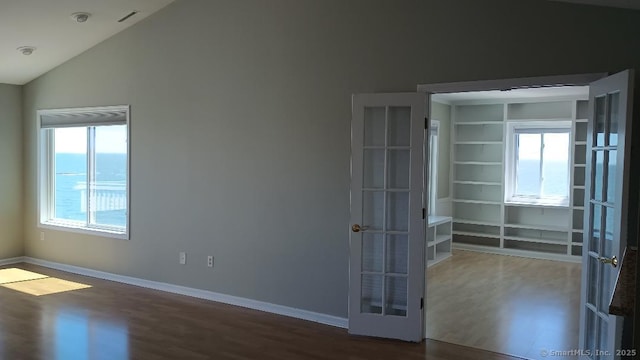5 Mansfield Grove Rd Apt 342, East Haven, CT 06512 - unfurnished room featuring lofted ceiling, baseboards, french doors, and wood finished floors