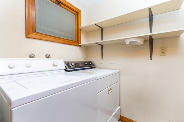 laundry area featuring laundry area and washer and clothes dryer