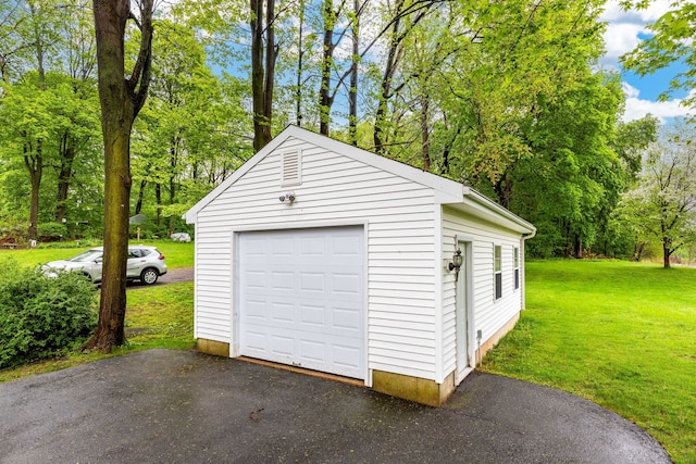 detached garage with aphalt driveway
