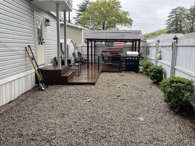 view of yard featuring a deck and a fenced backyard