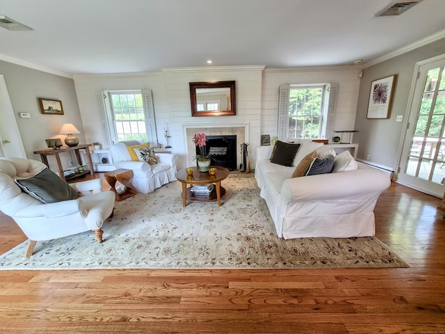 2 Ridgewood Dr, Danbury, CT 06811 - living room featuring ornamental molding, healthy amount of natural light, and wood finished floors