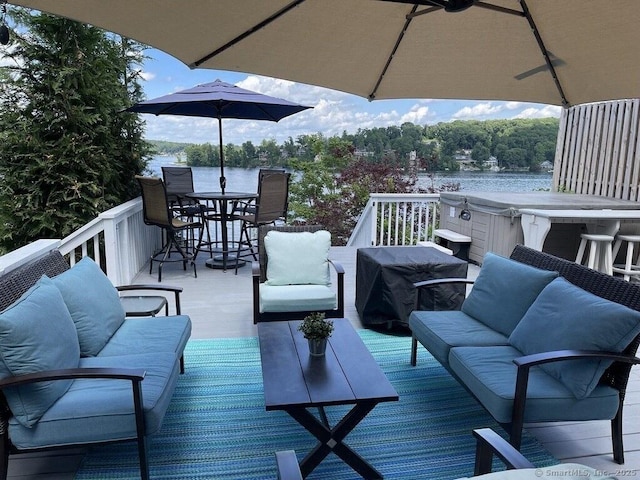 29 Old Neversink Rd, Danbury, CT 06811 - wooden terrace featuring outdoor dining area, a water view, and an outdoor hangout area